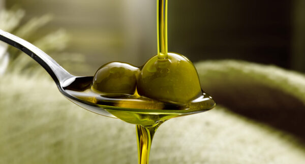 Pure Olive Pomace Oil in glass bottle for cooking and skincare